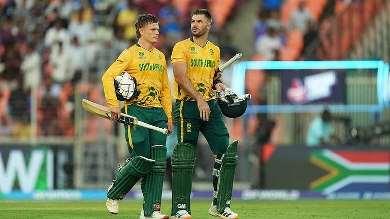 South Africa's captain Aiden Markram, right, and batting partner Ryan Rickelton leave the ground after winning their T20 World Cup cricket match against West Indies in Ahmedabad, India, Thursday, Feb. 26, 2026. - AP Photo/Ajit Solanki