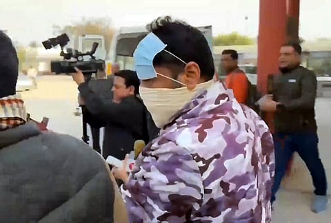 Delhi Police personnel escort arrested Indian Youth Congress (IYC) workers to the Civil Hospital for medical examination in connection with a protest at the AI Impact Summit in New Delhi, in Ambala, Haryana.