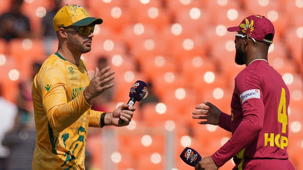 South Africa's captain Aiden Markram, left, and West Indies' skipper Shai Hope shake hands after the coin toss of their T20 World Cup match in Ahmedabad. - Photo: AP
