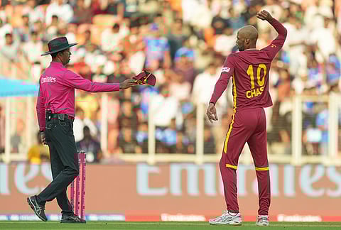 West Indies' Roston Chase celebrates the wicket of South Africa's Quinton de Kock during the T20 World Cup cricket match between South Africa and West Indies in Ahmedabad.