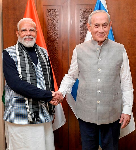 Israeli Prime Minister Benjamin Netanyahu greets Prime Minister Narendra Modi while wearing traditional Indian attire ahead of their joint dinner, in Israel. 