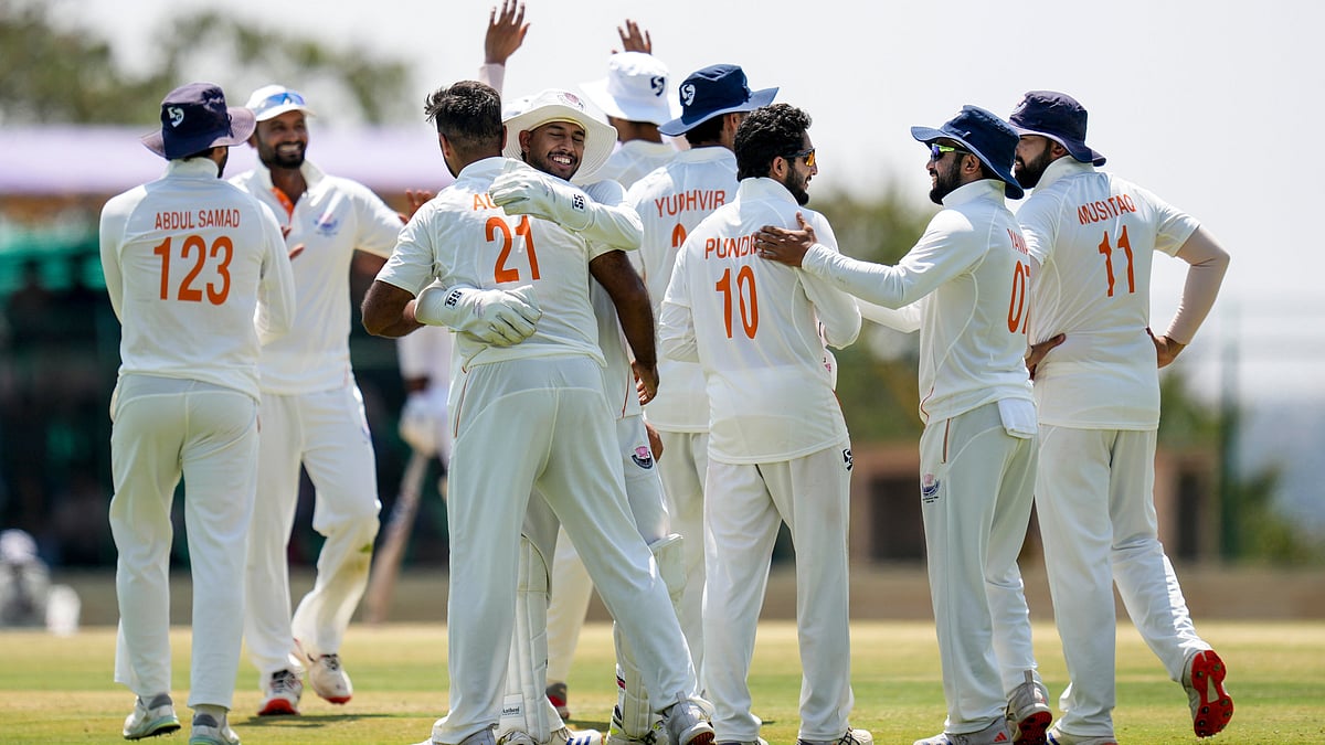 Jammu and Kashmir's Auqib Nabi celebrates with teammates after taking the wicket of Karnataka's Smaran Ravichandran during the third day of the Ranji Trophy 2025-26 final cricket match between Karnataka and Jammu and Kashmir at the KSCA Cricket Stadium, in Hubballi, Karnataka, Thursday, Feb. 26, 2026.  - | Photo: PTI/Shailendra Bhojak