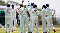 | Photo: PTI/Shailendra Bhojak : Jammu and Kashmir's Auqib Nabi celebrates with teammates after taking the wicket of Karnataka's Smaran Ravichandran during the third day of the Ranji Trophy 2025-26 final cricket match between Karnataka and Jammu and Kashmir at the KSCA Cricket Stadium, in Hubballi, Karnataka, Thursday, Feb. 26, 2026. 