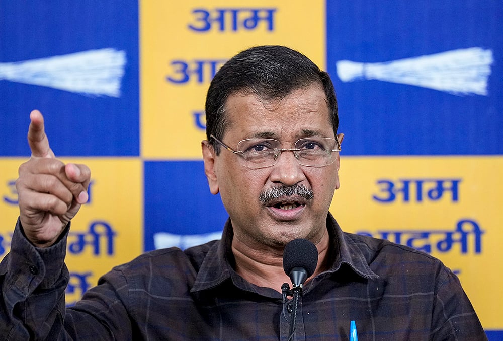 AAP chief and former Delhi chief minister Arvind Kejriwal addresses a press conference after getting a clean chit in the liquor policy case, in New Delhi. A Delhi court, which on Friday discharged Kejriwal and 21 others in the politically-charged liquor-policy case, expressed its displeasure with the CBI for using the phrase "South Group" while cautioning it to exercise restraint in its choice of language.  - | Photo: PTI/Karma Bhutia