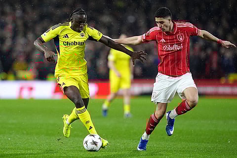 Fenerbahce's Sidiki Cherif, left, and Nottingham Forest's Jair Cunha during the Europa League knockout phase play-off second leg match between Nottingham Forest and Fenerbahce in Nottingham, England.