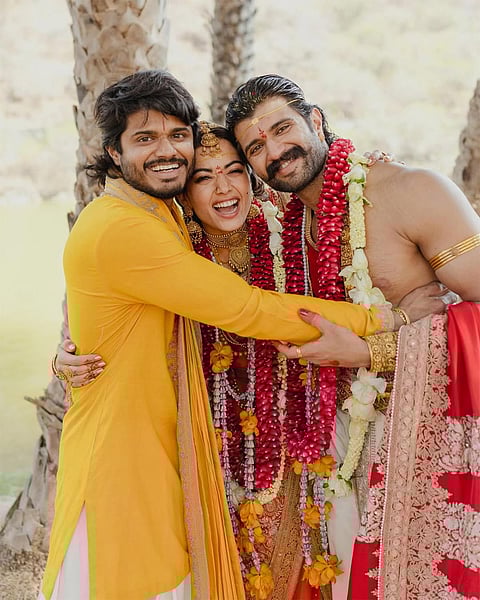 Anand Deverakonda with Actors Rashmika Mandanna and Vijay Deverakonda during the wedding ceremony on the outskirts of Udaipur, Rajasthan.