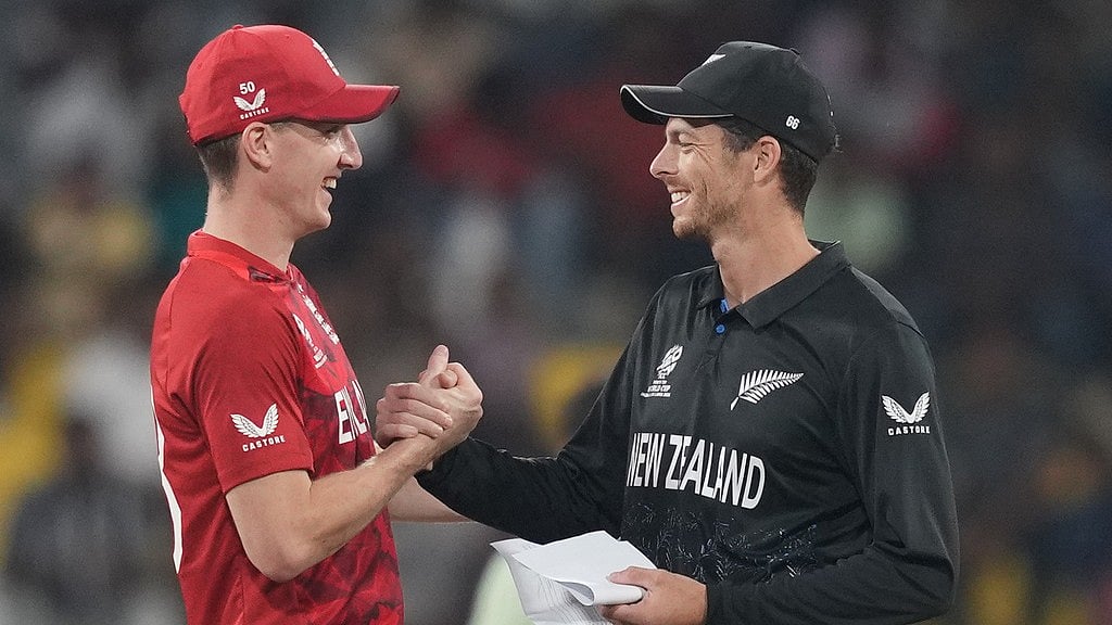 England's captain Harry Brook, left, and New Zealand's captain Mitchel Santner shake hands before the coin toss of the T20 World Cup cricket match between England and New Zealand in Colombo, Sri Lanka, Friday, Feb. 27, 2026.  - AP Photo/Eranga Jayawardena