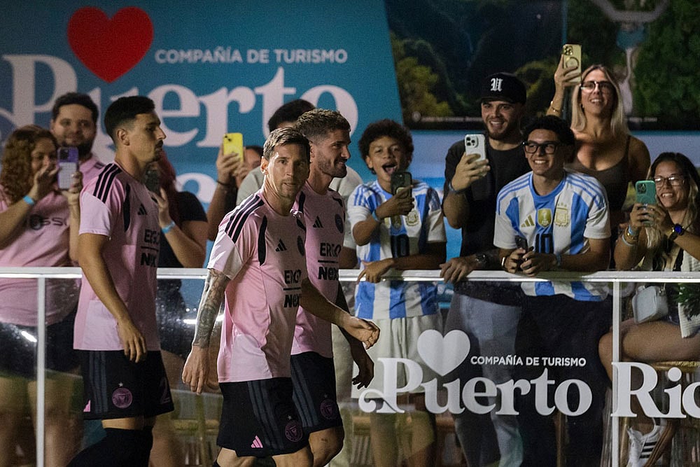 Inter Miamis Lionel Messi walks in front of fans