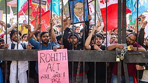 Source: PTI : Members of the Jawaharlal Nehru University Students' Union (JNUSU) stage a protest rally towards the Ministry of Education for stronger implementation of University Grants Commission regulations and enactment of the "Rohith Vemula Act", in New Delhi, Thursday, Feb. 26, 2026