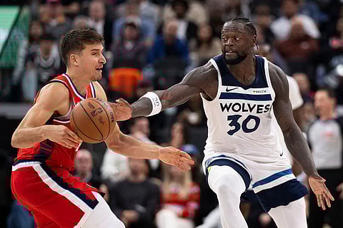 Minnesota Timberwolves forward Julius Randle, right, steals the ball away from Los Angeles Clippers guard Bogdan Bogdanovic during the second half of an NBA basketball game in Inglewood, Calif.
