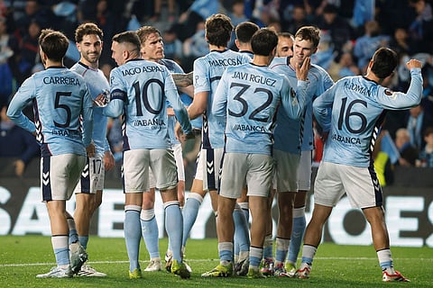 Celta's Williot Swedberg, second right, celebrates after scoring his side's first goal with his teammates during the second leg of the Europa League playoff soccer match between Celta Vigo and PAOK in Vigo, Spain.