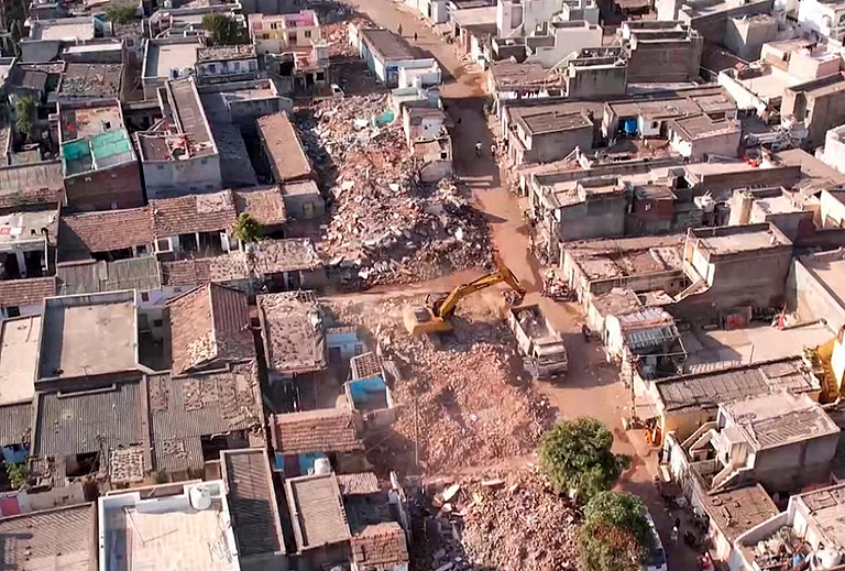 An aerial view shows the aftermath of a demolition drive to clear illegal houses along the Aji river banks and TP Road in Jangleshwar, Rajkot, Gujarat. - | Photo: PTI