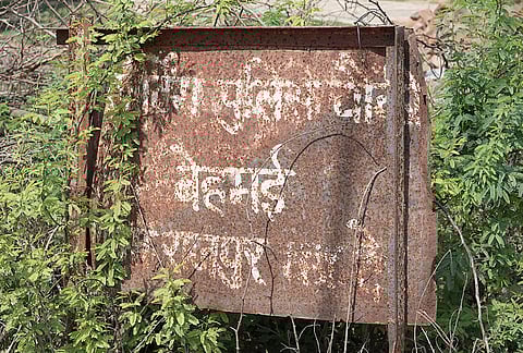 A dilapidated sign at the Village of Behmai, where Phoolan Devi massacred twenty two men from the Thakur community