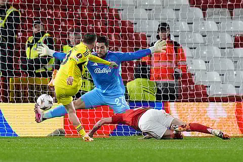 Fenerbahce's Kerem Akturkoglu, left, scores during the Europa League knockout phase play-off second leg match between Nottingham Forest and Fenerbahce in Nottingham, England.