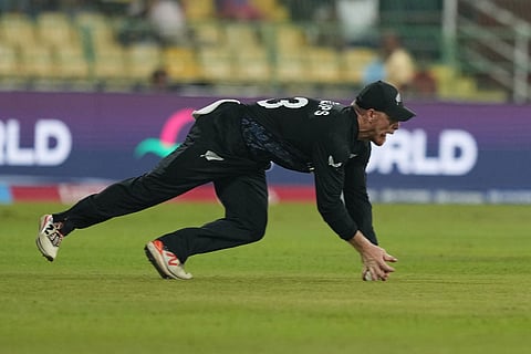 New Zealand's Glenn Phillips takes the catch to get dismiss England's Jacob Bethell during the T20 World Cup cricket match between England and New Zealand in Colombo, Sri Lanka.