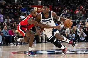 | Photo: AP/Kyusung Gong : Minnesota Timberwolves guard Anthony Edwards, right, drives to the basket as Los Angeles Clippers guard Kris Dunn defends during the second half of an NBA basketball game in Inglewood, Calif.