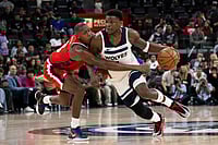 | Photo: AP/Kyusung Gong : Minnesota Timberwolves guard Anthony Edwards, right, drives to the basket as Los Angeles Clippers guard Kris Dunn defends during the second half of an NBA basketball game in Inglewood, Calif.