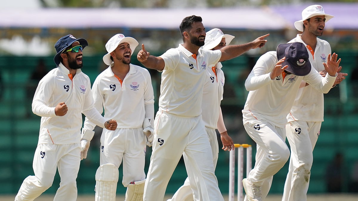 Jammu and Kashmir's Auqib Nabi with teammates, celebrates the wicket of Karnataka's Mayank Agarwal on day four of their Ranji Trophy 2025-26 final at KSCA Cricket Stadium in Hubballi. - PTI