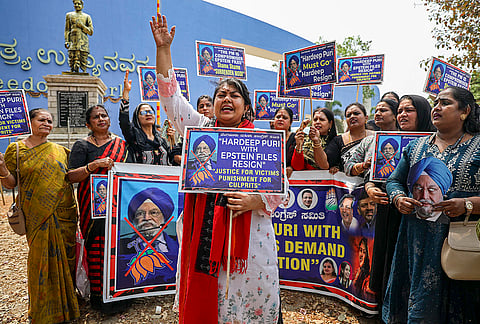 President of the Karnataka Pradesh Mahila Congress Sowmya Reddy with other members stages a protest demanding the resignation of Union Minister Hardeep Puri after his name figured in the 'Epstein Files' released in the United States, in Bengaluru.
