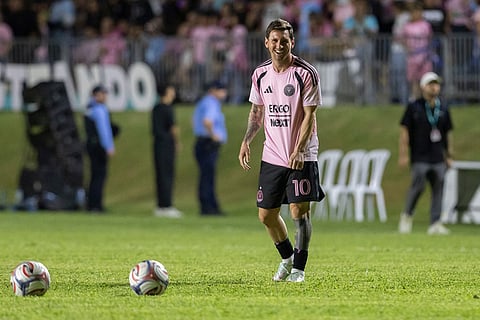 Inter Miami's Lionel Messi warms up before an international friendly soccer match against Ecuador's Independiente del Valle in Bayamon, Puerto Rico.