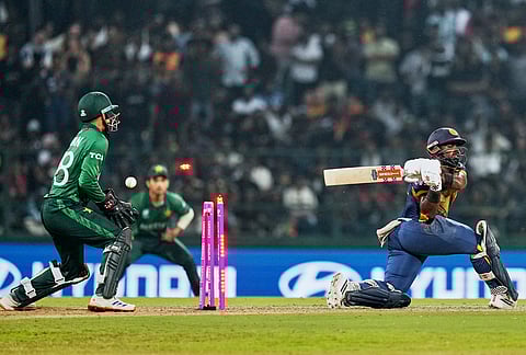 Sri Lanka's Charith Asalanka is bowled out by Pakistan's Abrar Ahmed during the T20 World Cup cricket match between Pakistan and Sri Lanka in Pallekele, Sri Lanka.