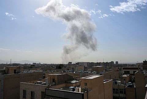 Smoke rises on the skyline after an explosion in Tehran, Iran.