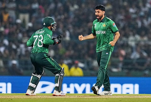 Pakistan's Abrar Ahmed, right, celebrates prematurely for the wicket of Sri Lanka's Kamindu Mendis, who was ruled not out by the third umpire, during the T20 World Cup cricket match between Pakistan and Sri Lanka in Pallekele, Sri Lanka.