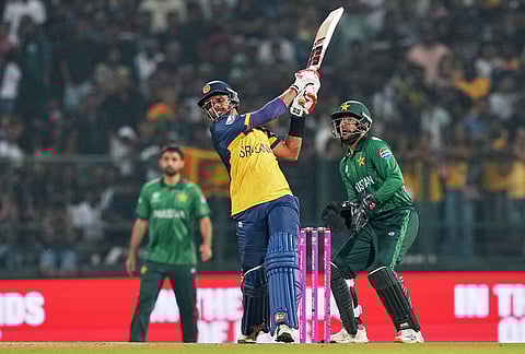 Sri Lanka's captain Dasun Shanaka plays a shot during the T20 World Cup cricket match between Pakistan and Sri Lanka in Pallekele, Sri Lanka.