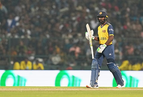 Sri Lanka's Janith Liyanage leaves the ground after losing his wicket during the T20 World Cup cricket match between Pakistan and Sri Lanka in Pallekele, Sri Lanka.