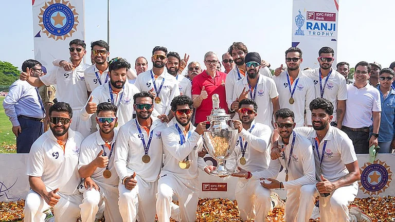 Jammu and Kashmir Chief Minister Omar Abdullah poses with players during the felicitation ceremony after the team's victory in the Ranji Trophy 2025-26 final cricket match against Karnataka, at KSCA Stadium, in Hubballi, Karnataka. - | Photo: PTI/Shailendra Bhojak