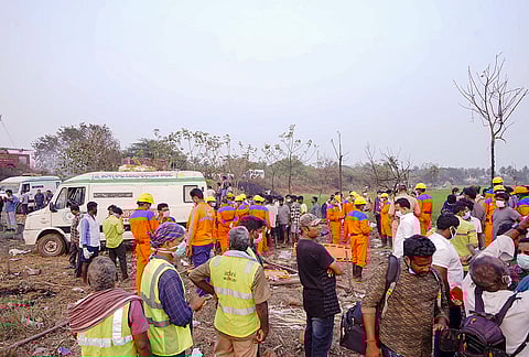 Rescue personnel and others at work at the site where as many as 21 people were killed and 8 others critically injured in the cracker unit blast at Vetlakpalem, in Kakinada district. 
