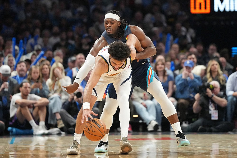 | Photo: AP/Kyle Phillips : Oklahoma City Thunder guard Luguentz Dort, back, tries to steal the ball from Denver Nuggets guard Jamal Murray during the second half of an NBA basketball game in Oklahoma City.