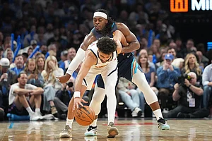 | Photo: AP/Kyle Phillips : Oklahoma City Thunder guard Luguentz Dort, back, tries to steal the ball from Denver Nuggets guard Jamal Murray during the second half of an NBA basketball game in Oklahoma City.