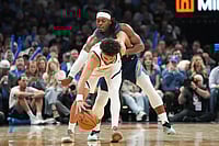 | Photo: AP/Kyle Phillips : Oklahoma City Thunder guard Luguentz Dort, back, tries to steal the ball from Denver Nuggets guard Jamal Murray during the second half of an NBA basketball game in Oklahoma City.