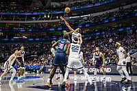 | Photo: AP/Jessica Tobias : Memphis Grizzlies guard Rayan Rupert, top center right, and Dallas Mavericks guard Miles Kelly, top center left, compete for a jump ball during an NBA basketball game in Dallas.