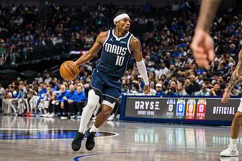 Dallas Mavericks guard Brandon Williams (10) dribbles during an NBA basketball game against the Memphis Grizzlies in Dallas.