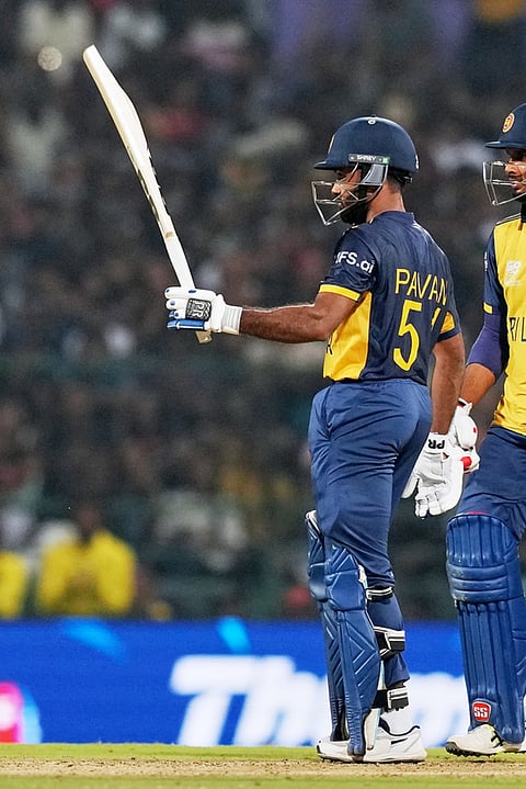 Sri Lanka's Pavan Rathnayake celebrates his fifty runs during the T20 World Cup cricket match between Pakistan and Sri Lanka in Pallekele, Sri Lanka.