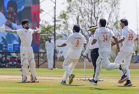 Jammu and Kashmir's Sahil Lotra, left, with teammates celebrates the team's victory in the Ranji Trophy 2025-26 final cricket match against Karnataka, at KSCA Stadium, in Hubballi, Karnataka.