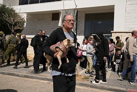 Residents are evacuated from a building hit by a projectile in Tirat Hacarmel, near Haifa, northern Israel, northern Israel. No injuries were reported. 