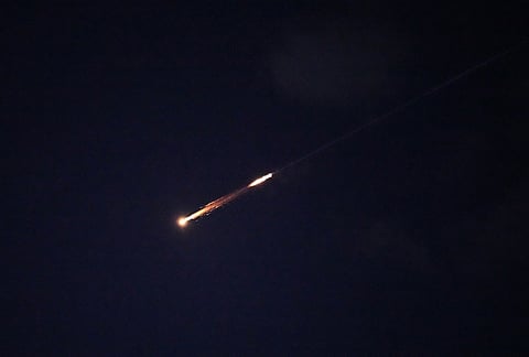 Traces of an air defense missile interception are seen over Jerusalem.