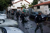 West Asia On The Brink As US-Backed Israel And Iran Exchange Blows | Photo: AP/Tomer Appelbaun : Israeli policemen survey a missile attack from Iran in Rosh HaAyin, Israel.