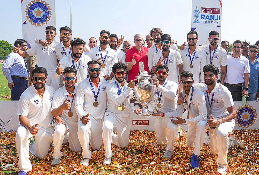 Jammu and Kashmir Chief Minister Omar Abdullah poses with players during the felicitation ceremony after the team's victory in the Ranji Trophy 2025-26 final cricket match against Karnataka, at KSCA Stadium, in Hubballi, Karnataka. - | Photo: PTI/Shailendra Bhojak