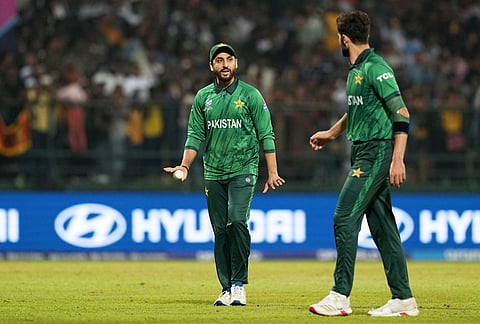 Pakistan's captain Salman Ali Agha, left, has a word with teammate Shaheen Shah Afridi during the T20 World Cup cricket match between Pakistan and Sri Lanka in Pallekele, Sri Lanka.