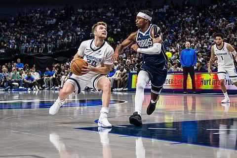 Memphis Grizzlies guard Cam Spencer (24) looks to shoot during an NBA basketball game against the Dallas Mavericks in Dallas.