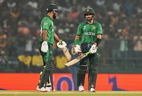 Pakistan's Sahibzada Farhan, right, celebrates with batting partner Fakhar Zaman his fifty runs during the T20 World Cup cricket match between Pakistan and Sri Lanka in Pallekele, Sri Lanka.