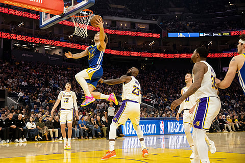 Golden State Warriors guard Brandin Podziemski (2) drives for a layup during the first quarter of his NBA basketball game against the Los Angeles Lakers in San Francisco.