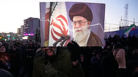 9 Dead in Karachi as Protests Over Khamenei’s Killing Turn Violent Outside US Consulate | Photo: AP/Vahid Salemi : Government supporters mourn in a gathering after state TV officially announced the death of Iranian Supreme Leader Ayatollah Ali Khamenei, shown in the poster, in Tehran, Iran.