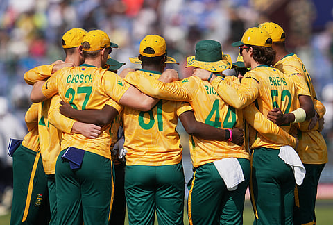 South Africa's team huddles together before the start of the T20 World Cup cricket match between South Africa and Zimbabwe in New Delhi.