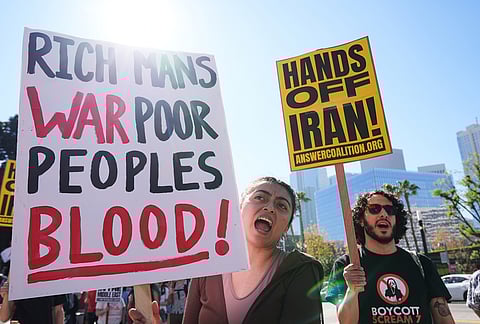 Protesters shout slogans during a demonstration in reaction to the U.S. and Israeli strikes on Iran in Los Angeles. 
