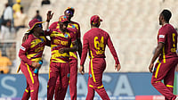 | Photo: AP/Bikas Das : West Indies' Matthew Forde, right, celebrates the wicket of Italy's Gian Piero Meade during the T20 World Cup cricket match between West Indies and Italy in Kolkata.